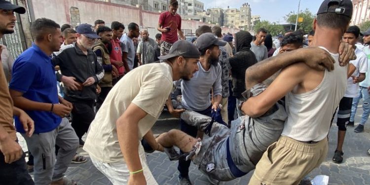 Dozens killed by Israeli fire as they sought desperately needed aid in Gaza, Palestinian health ministry says